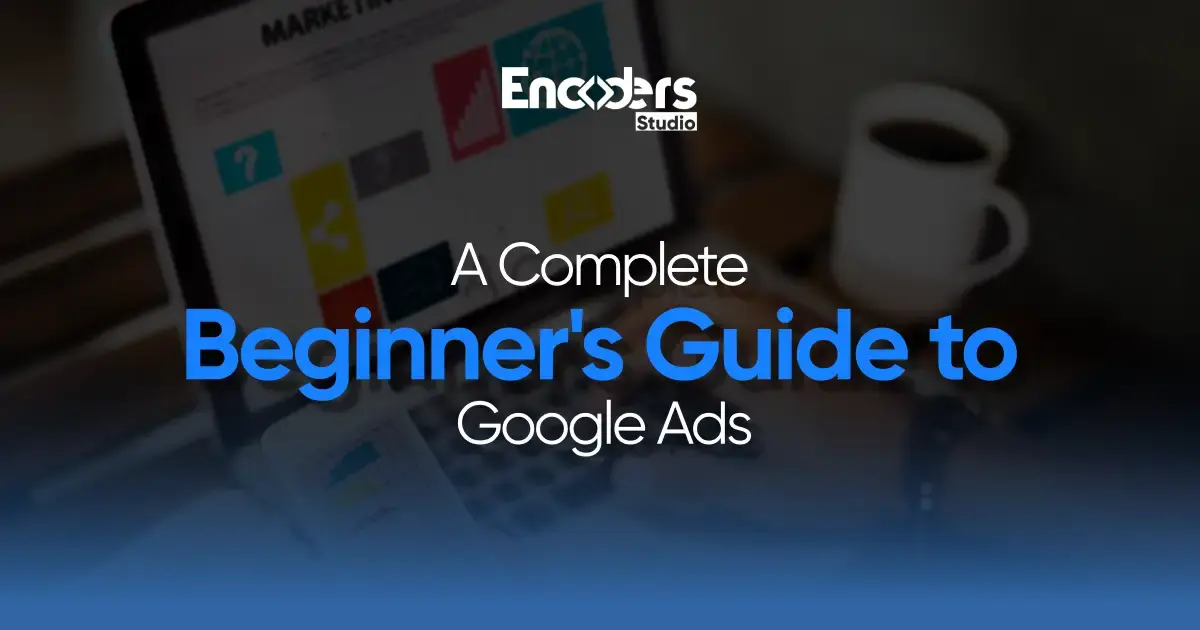 Laptop showing "A Complete Beginner's Guide to Google Ads" title with a coffee cup nearby.